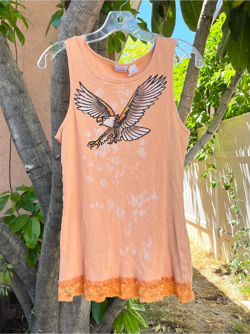Vintage Y2K No Boundaries Orange Eagle Graphic Ribbed Tank Top with a Lace Hem.